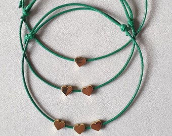Bracelet with a gold-plated heart on a thin cord