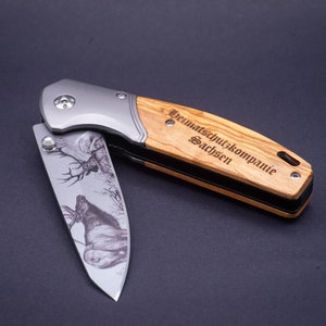 Pocket knife / folding knife with individual engraving on the handle and hunting motif on the blade