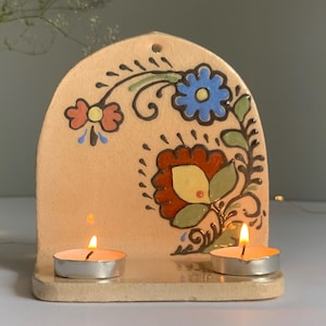 Ceramic altar with painted flowers