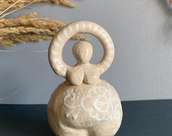 Ceramic Madonna. White clay goddess of fertility