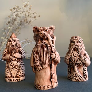 A set of three Slavic gods Rod, Perun, Veles. Pagan altar