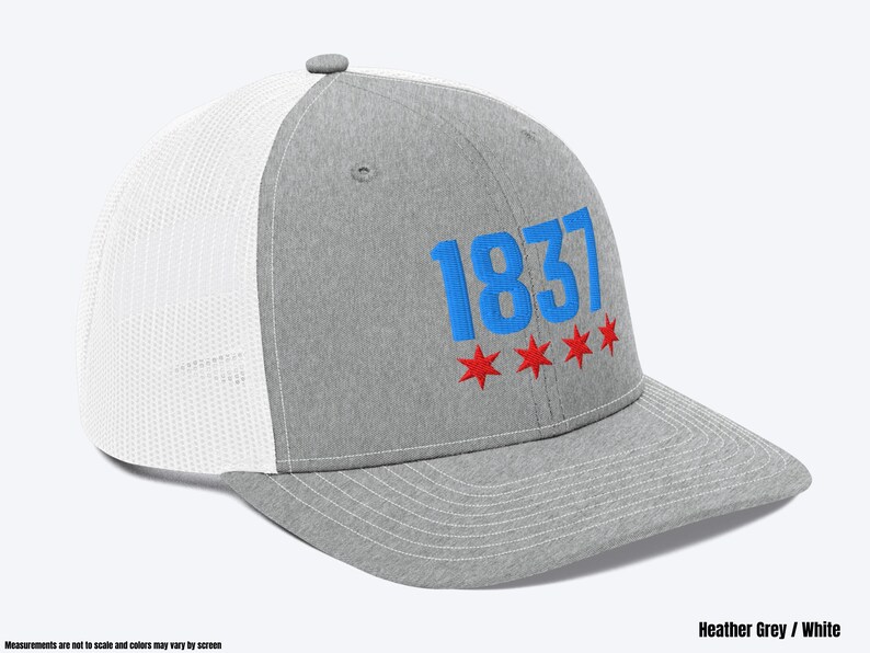 May include: A heather grey and white trucker hat with a blue and red embroidered design. The design features the number "1837" and five red stars.