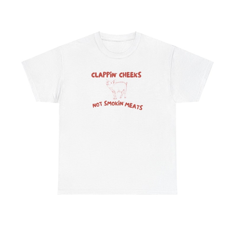May include: White t-shirt with red text that says "Clappin' Cheeks Not Smokin' Meats" and a cartoon pig illustration.