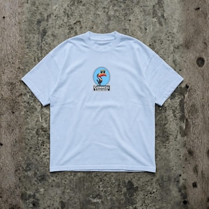 K&ouml;nnte beinhalten: Hellblaues T-Shirt mit einem kreisf&ouml;rmigen Grafikdesign, das einen Tukan und das Guinness-Logo zeigt. Die Grafik ist in Rot-, Orange- und Blaut&ouml;nen gehalten. Das Shirt besteht aus weichem Material und hat einen Rundhalsausschnitt.