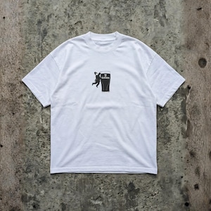 May include: White t-shirt featuring a black graphic of a person climbing a pint of Guinness. The Guinness logo is visible on the pint. The shirt has short sleeves and a crew neck.