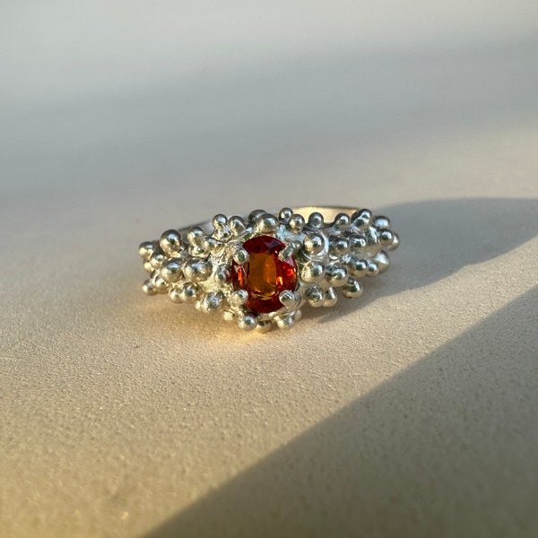 Silver ring with orange saphir