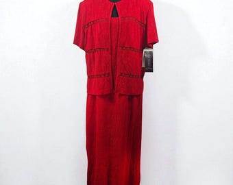 May include: A red two-piece dress set on a black mannequin. The set includes a short-sleeved jacket with decorative trim and a matching floor-length dress. A tag hangs from the jacket. The fabric has a textured appearance.