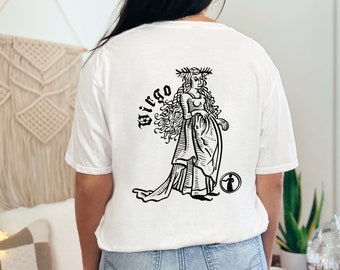 May include: White t-shirt with a black and white illustration of a woman with long hair and the word "Virgo" printed on the back.