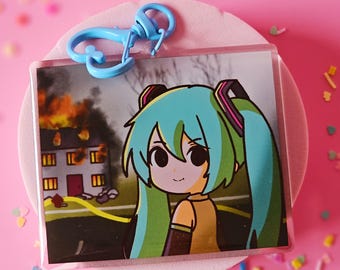 Miku disaster girl meme double sided print acrylic keychain with full epoxy finish