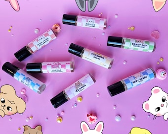 May include: Eight small roller bottles with colorful labels and cartoon animal illustrations. The labels include names like "Sunshine", "Dandy Boy", "Baby Bread", and "Jutrae".