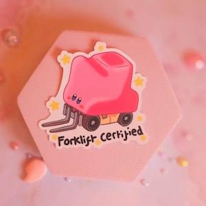 May include: A pink cartoon forklift with a yellow star design and the text "Forklift Certified".