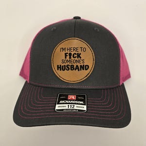I am Here to F%&! Someone's Husband Leatherette Trucker Hat