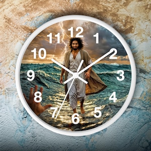 May include: White clock with black Roman numeral hour markers and black hands. The clock face features a stormy sea with a man walking on the water. The man is wearing a white robe and has long brown hair.