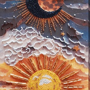 May include: A beaded artwork depicting a celestial scene. The image features a crescent moon, a radiant sun, and fluffy clouds. The artwork uses various colors, including blue, orange, and white, to create a detailed and textured design.