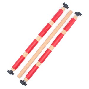 May include: Three cylindrical wooden rods arranged diagonally. Two rods feature multiple red plastic sleeves and black plastic wing nuts at the ends. The third rod is plain light-colored wood without sleeves or hardware attachments.