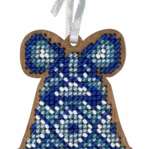 May include: Wooden Christmas bell ornament with a blue and white beaded design. The ornament has a bow-shaped top and a silver ribbon for hanging. The bell shape is approximately 4 inches tall.