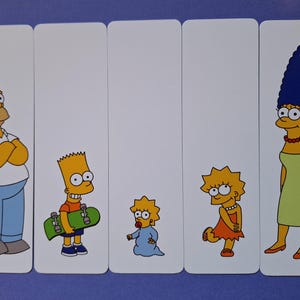 May include: Set of five bookmarks featuring characters from the animated television series The Simpsons. The bookmarks are white with a yellow border and feature Homer, Bart, Maggie, Lisa, and Marge Simpson.