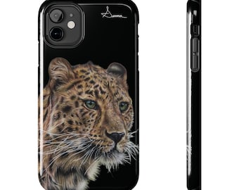 May include: A black phone case featuring a close-up image of a leopard's face. The leopard has brown and black spots and white whiskers. The case has a black background with the word "Duma" written in white in the top right corner.
