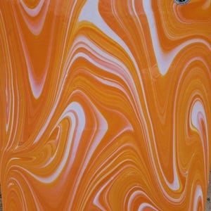May include: A smooth, flat surface featuring a vibrant marbled pattern of swirling orange, yellow, and white colors. The design consists of fluid, elongated curves that create a continuous, abstract effect across the entire rectangular area.