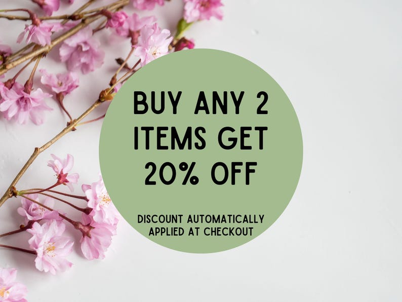 May include: A green circle with white text that reads "BUY ANY 2 ITEMS GET 20% OFF" and "DISCOUNT AUTOMATICALLY APPLIED AT CHECKOUT". The circle is surrounded by pink cherry blossoms.