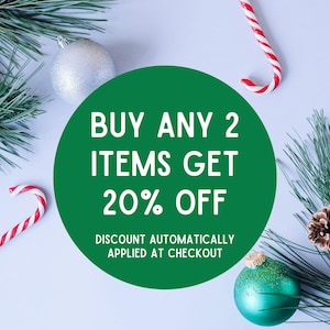 May include: Green circle with white text that reads "BUY ANY 2 ITEMS GET 20% OFF" and "DISCOUNT AUTOMATICALLY APPLIED AT CHECKOUT". The circle is surrounded by pine branches, ornaments, and candy canes.