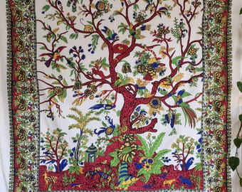 May include: A white tapestry with a colorful tree of life design. The tree is surrounded by flowers, birds, and animals. The tapestry has a red, green, and blue border.
