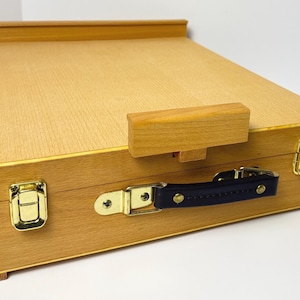 May include: A rustic wooden sign with the text "Welcome to our home" in white lettering. The sign features a distressed finish and a simple, inviting design, perfect for entryway decor.