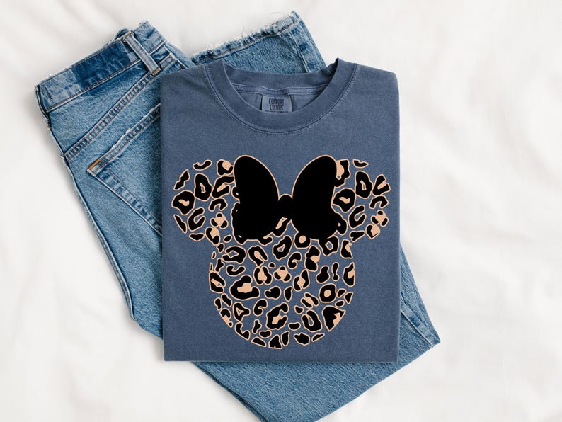 May include: A set of three ceramic mugs with a speckled, matte finish. The mugs are in shades of cream, light gray, and dark gray. Each mug has a simple, minimalist design and a rounded handle.