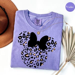 May include: A set of three ceramic mugs with a speckled, matte finish. The mugs are in shades of cream, light gray, and dark gray. Each mug has a simple, minimalist design, perfect for coffee or tea.