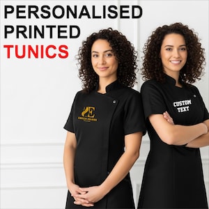 May include: Two women wearing black tunics. The tunics have short sleeves and a mandarin collar. One tunic has a gold logo, and the other has the text "CUSTOM TEXT" in white. The words "PERSONALISED PRINTED TUNICS" are at the top.