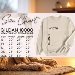 May include: A cream-colored Gildan 18000 heavy blend sweatshirt with a size chart. The chart lists measurements for sizes S to 2XL, including width, length, and sleeve length in inches. The sweatshirt is displayed on a light background.