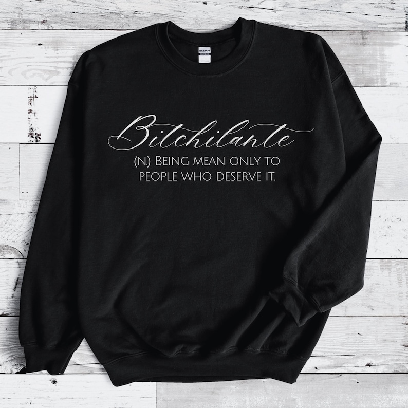 May include: Black sweatshirt with the word "Bitchilante" in a cursive font. Below the word is the definition: "(N) BEING MEAN ONLY TO PEOPLE WHO DESERVE IT."