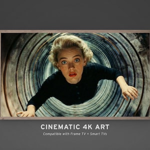 May include: A framed cinematic art print featuring a woman with blonde hair and a black top, looking up with a surprised expression. The background shows a tunnel-like structure. The text "CINEMATIC 4K ART" is displayed at the bottom.