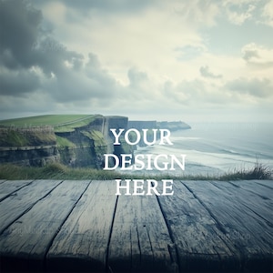Puede incluir: Una mesa de madera con vista a un acantilado rocoso y el océano en el fondo. El texto "YOUR DESIGN HERE" está superpuesto en la imagen.