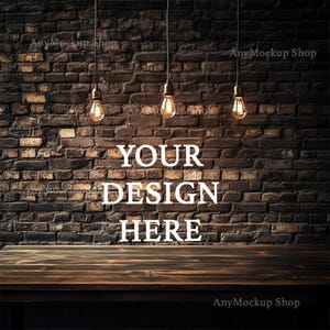 May include: A rustic wooden table with a brick wall background. Three hanging light bulbs illuminate the scene. The text "YOUR DESIGN HERE" is displayed in white on the brick wall.