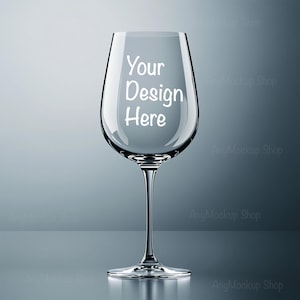 May include: A clear glass wine glass with a stem and a wide bowl. The glass is empty and has the text "Your Design Here" printed on the side.