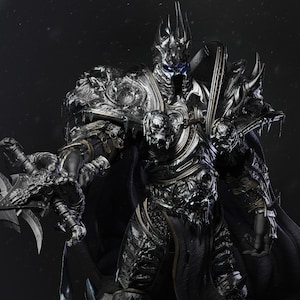 May include: A black and silver armoured figure with a crown and a sword. The figure has blue eyes and a menacing expression.