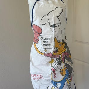Vintage BBQ Novelty Apron – “Caution: Man at Work!” Funny Grilling Apron – 80s Cartoon Chef Apron