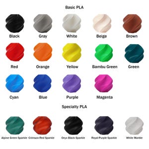 May include: A color chart of 15 different colors of 3D printing filament. The colors are arranged in two rows, with the top row labeled "Basic PLA" and the bottom row labeled "Specialty PLA". The colors include black, gray, white, beige, brown, red, orange, yellow, green, blue, purple, magenta, cyan, alpine green sparkle, crimson red sparkle, onyx black sparkle, royal purple sparkle, and white marble.