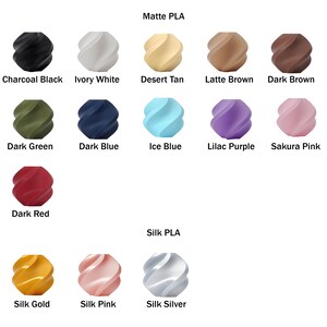 May include: A color chart showing 15 different colors of 3D printing filament. The filament is available in both matte and silk finishes. The colors include charcoal black, ivory white, desert tan, latte brown, dark brown, dark green, dark blue, ice blue, lilac purple, sakura pink, dark red, silk gold, silk pink, and silk silver.
