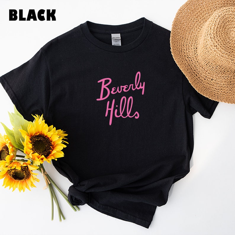 May include: Black t-shirt with a pink "Beverly Hills" graphic.