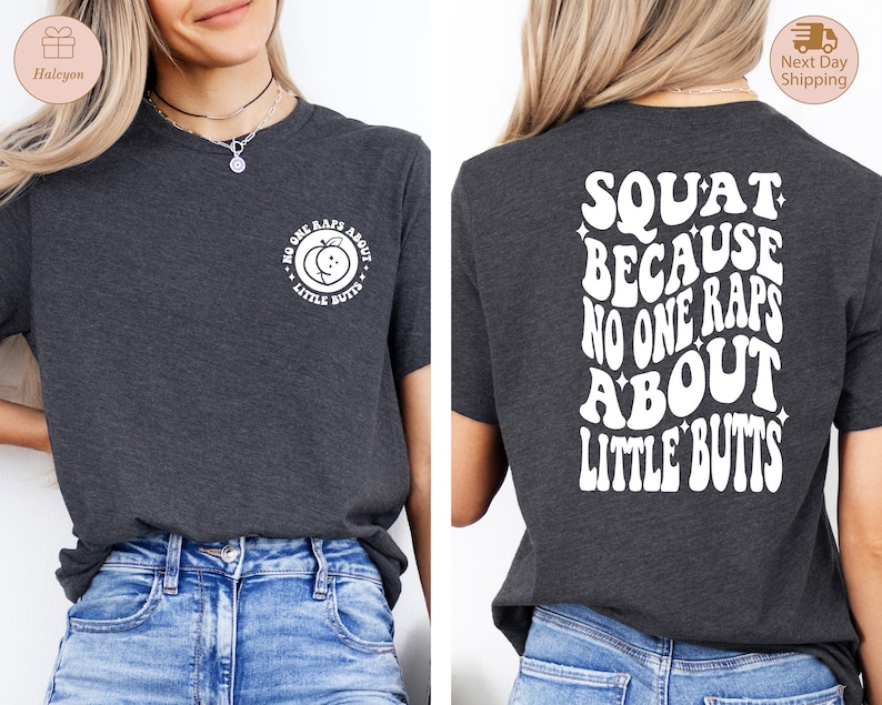 May include: A dark gray t-shirt with a white peach graphic on the front and the text "No one raps about little butts" on the back. The text is in a retro font style.