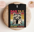 Dad Tax Raccoon Shirt, Funny Dad Tax T-Shirt, Retro Style Dad Tee, Gift for Dad, Funny Dad Gifts, Taxation Shirt, Fathers Day Gift product logo