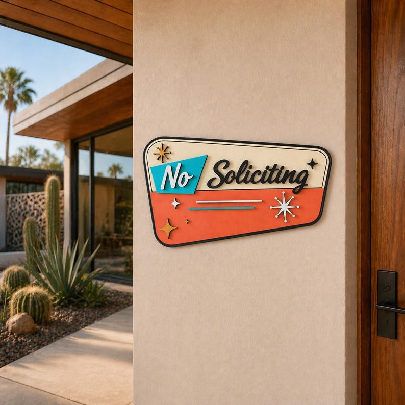 May include: A trapezoidal wall sign with a cream background, a teal section, and an orange section. The sign features the black text No Soliciting in a script font, accented by decorative starburst shapes in white, gold, and black colors.