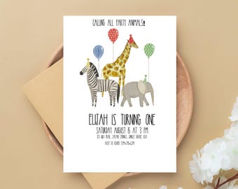 May include: A white invitation card with the text "CALLING ALL PARTY ANIMALS!" and "ELIJAH IS TURNING ONE". The card features illustrations of a zebra, giraffe, and elephant with balloons and party hats. The card is on a wooden tray.