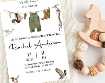 May include: Baby shower invitation with watercolor illustrations of ducks, a bow and arrow, and baby clothes. The invitation reads "A little hunter is on the way" and includes the date, time, and location for the event.