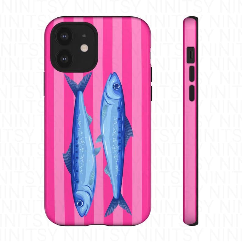 May include: A pink phone case with vertical stripes and two blue fish illustrations. The case has a glossy finish and a slim profile, with a matching pink side. The design is repeated on the back and side of the phone case.