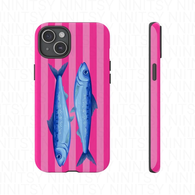 May include: A phone case featuring a vibrant pink and white striped background. Two blue fish are centered on the case. The case is shown from the front and side, showcasing the design and the phone's camera.