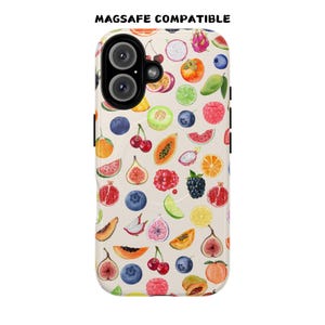 May include: A white phone case with a colorful fruit pattern. The case is compatible with MagSafe.