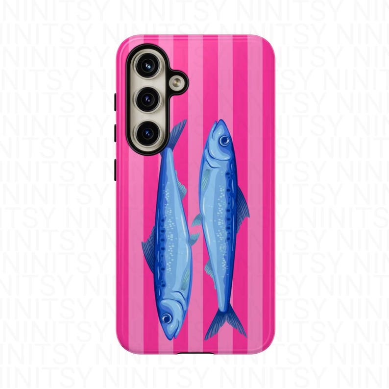 May include: A phone case featuring a vibrant pink and white striped background. Two blue fish are centered on the case. The phone case has a camera and button cutouts.